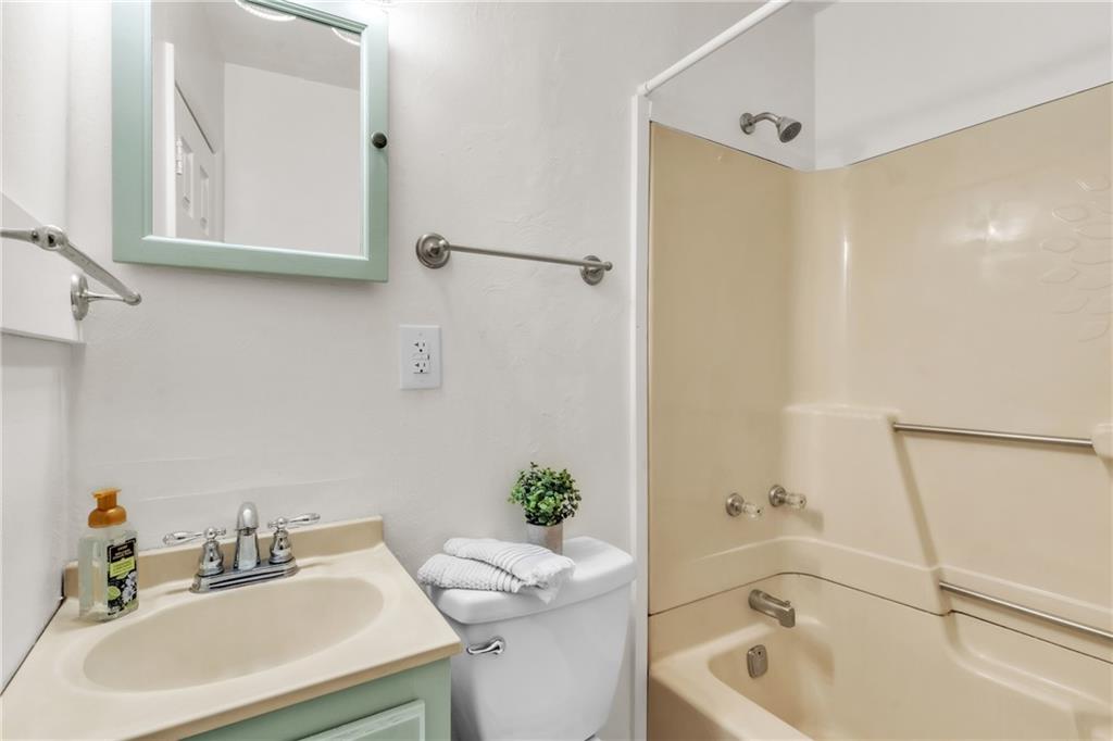 157 Studebaker Road Slippery Rock, PA 16057 - Photo 12 of 34 a bathroom with a sink mirror toilet and bathtub