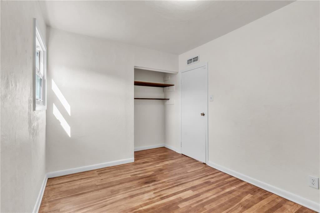157 Studebaker Road Slippery Rock, PA 16057 - Photo 23 of 34 a view of an empty room with wooden floor and a window