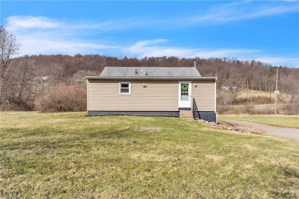 157 Studebaker Road Slippery Rock, PA 16057 - Photo 30 of 34 a view of a backyard with a garden and stairs