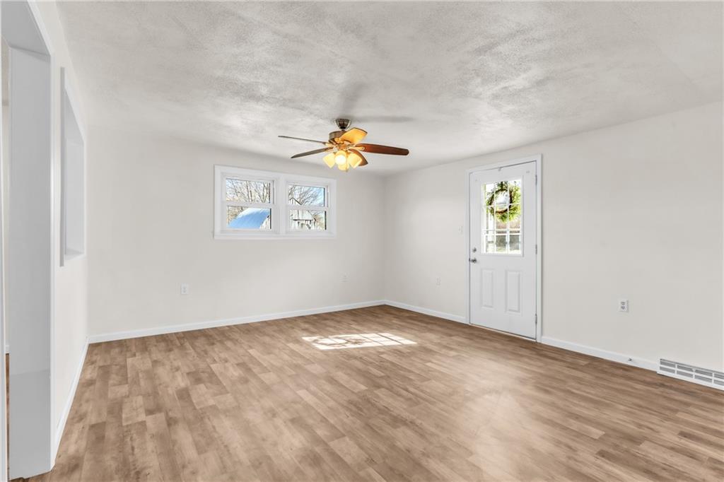 157 Studebaker Road Slippery Rock, PA 16057 - Photo 4 of 34 wooden floor in an empty room with a window