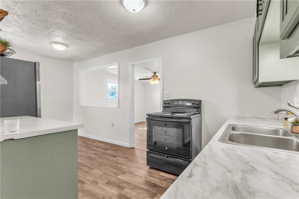 157 Studebaker Road Slippery Rock, PA 16057 - Photo 9 of 34 a kitchen that has a sink and a stove top oven