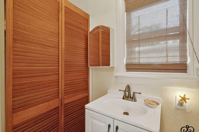 a bedroom with a bed and a table