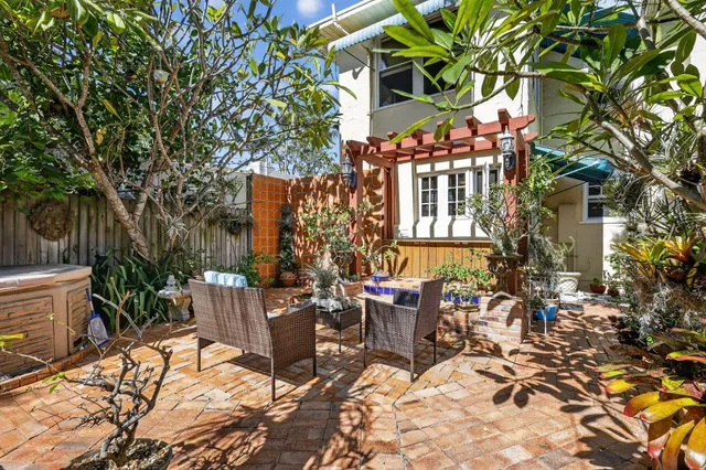 a bedroom with a bed and a large window with outer view