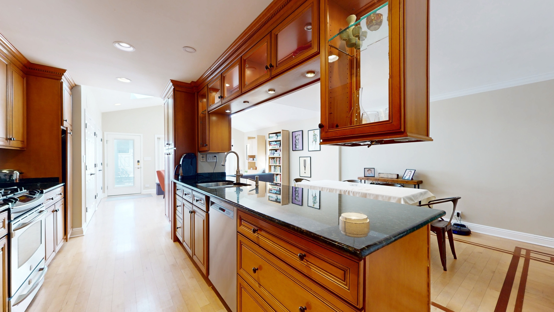 804 South Morgan Street Chicago, IL 60607 - Photo 9 of 32 a kitchen with kitchen island granite countertop a sink and counter top space