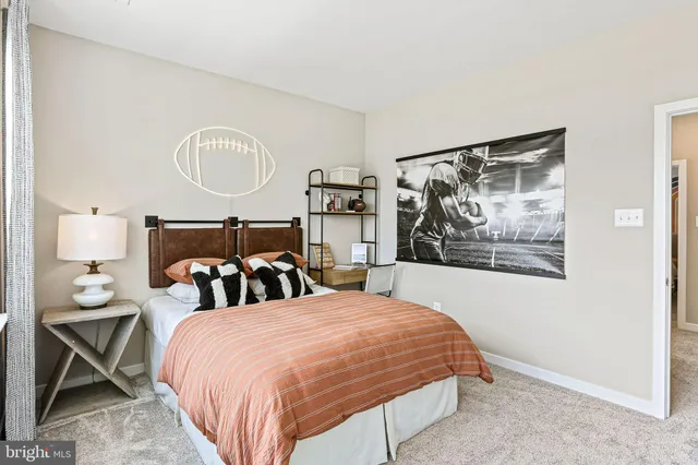 a bedroom with bed and night stand