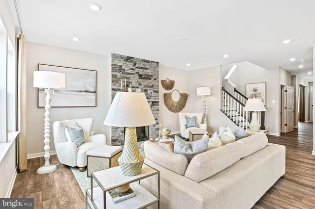 a living room with furniture and a lamp