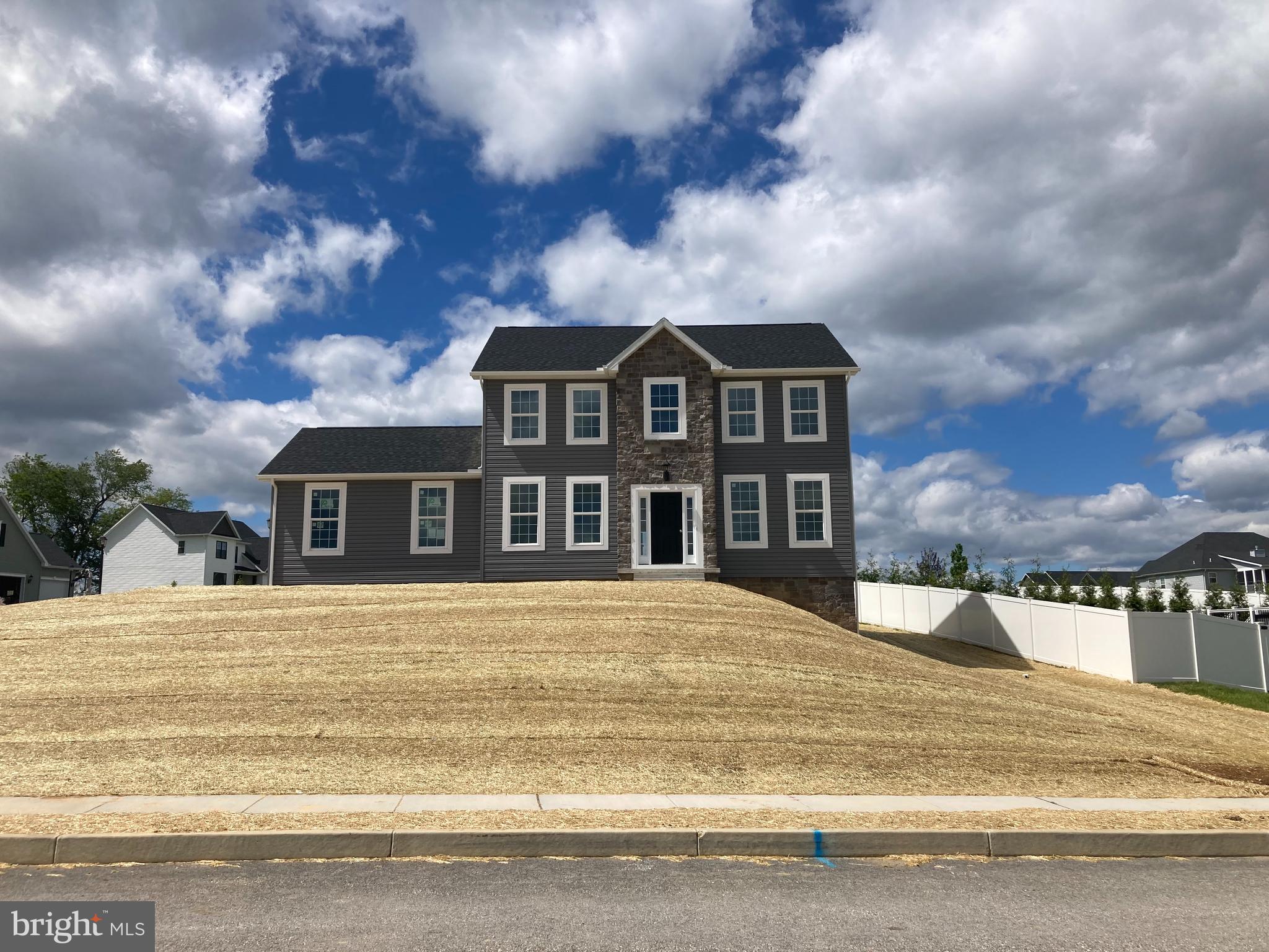 1420 Maple Lane, Unit 104 Hanover, PA 17331 - Photo 1 of 1 a front view of a house with a yard