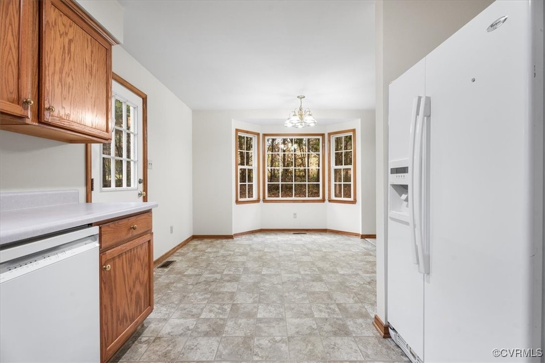 2492 Three Bridge Road Powhatan, VA 23139 - Photo 13 of 37 KITCHEN VIEWS WITH DOOR TO DECK AND PANTRY