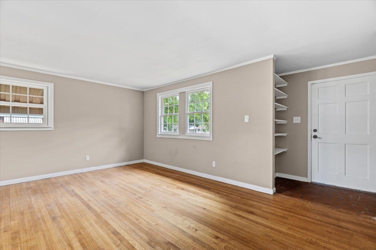 1176 South White Station Road Memphis, TN 38117 - Photo 5 of 15 Interior space featuring wood-finish flooring, neutral wall paint, and white trim