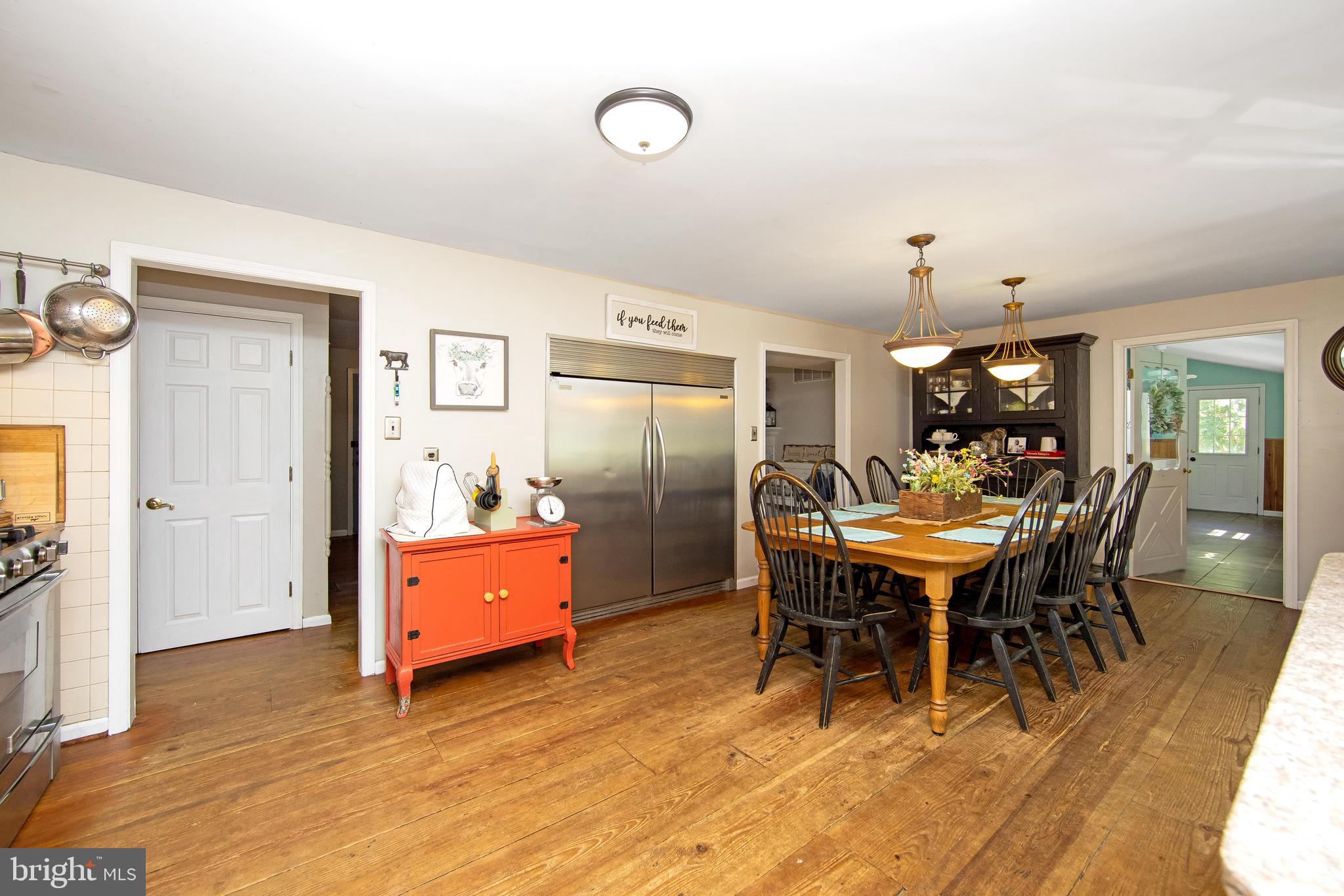 27 Wicklow Drive Tabernacle, NJ 08088 - Photo 13 of 65 a dining room with a wooden table and chairs