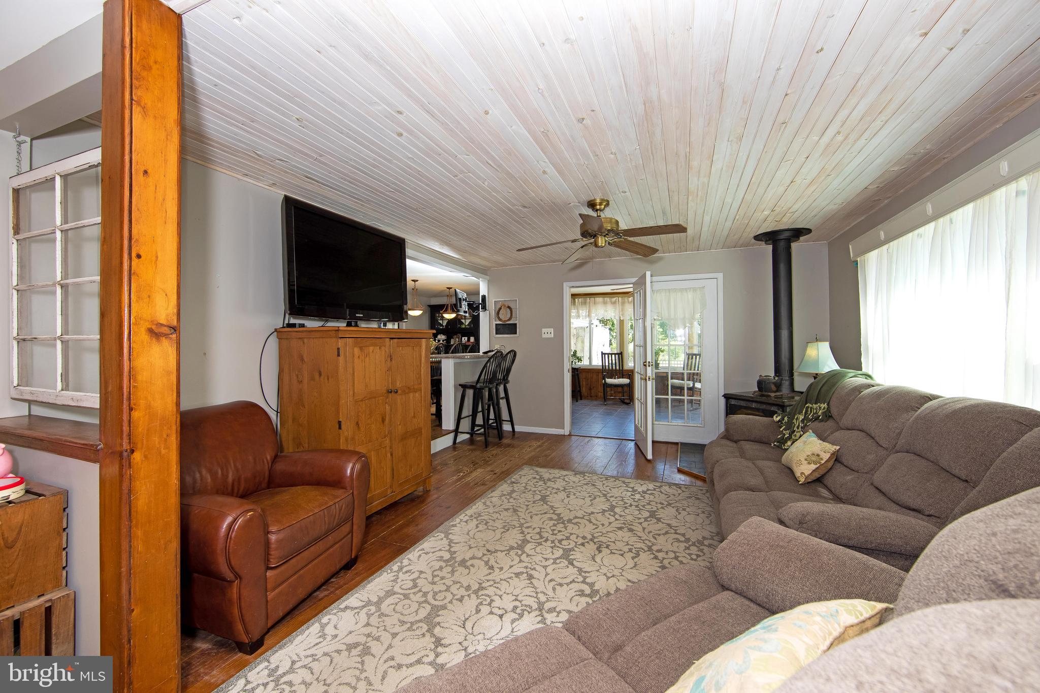27 Wicklow Drive Tabernacle, NJ 08088 - Photo 16 of 65 a living room with furniture a flat screen tv and a chandelier