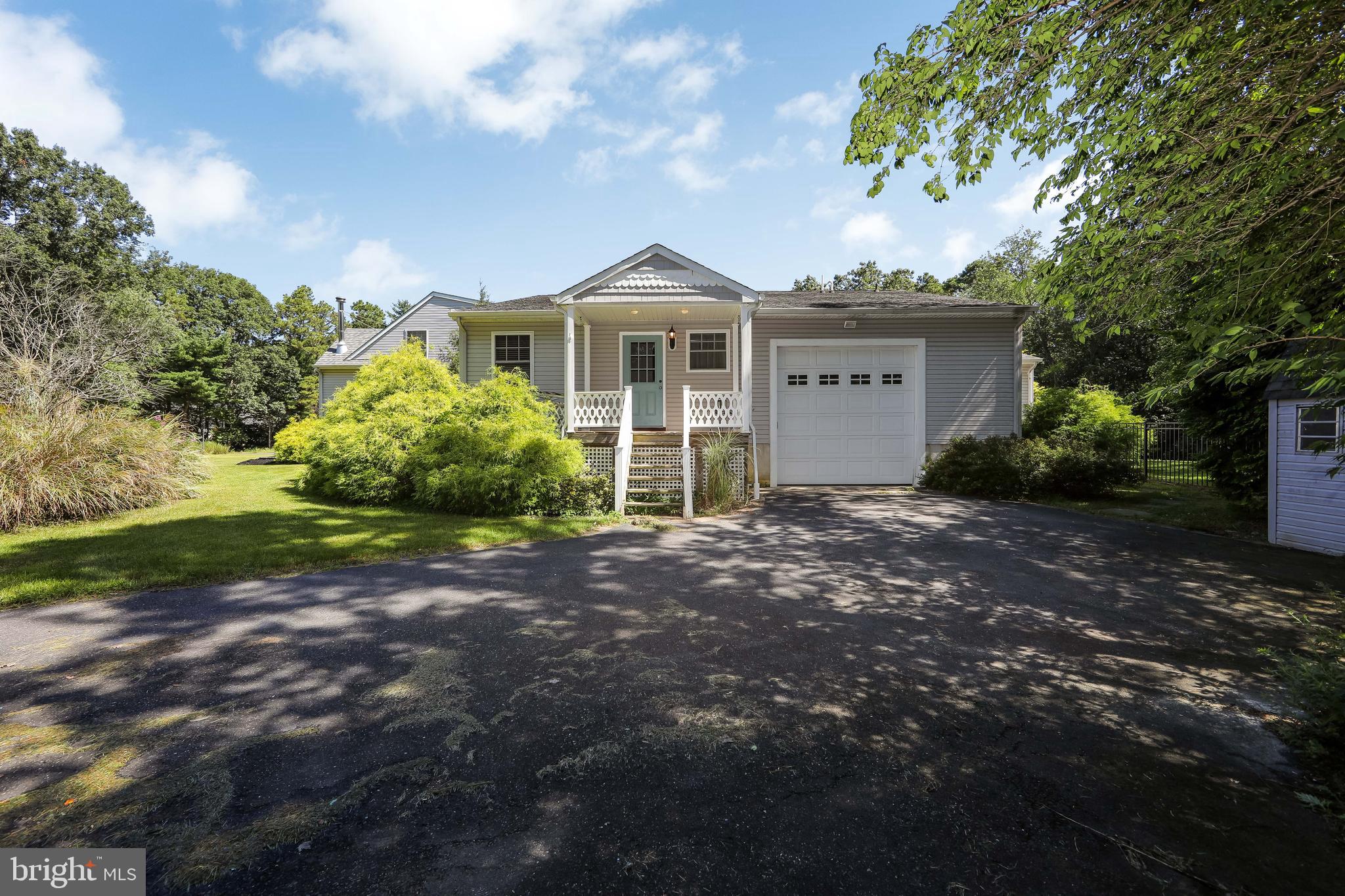 27 Wicklow Drive Tabernacle, NJ 08088 - Photo 3 of 65 a front view of a house with garden