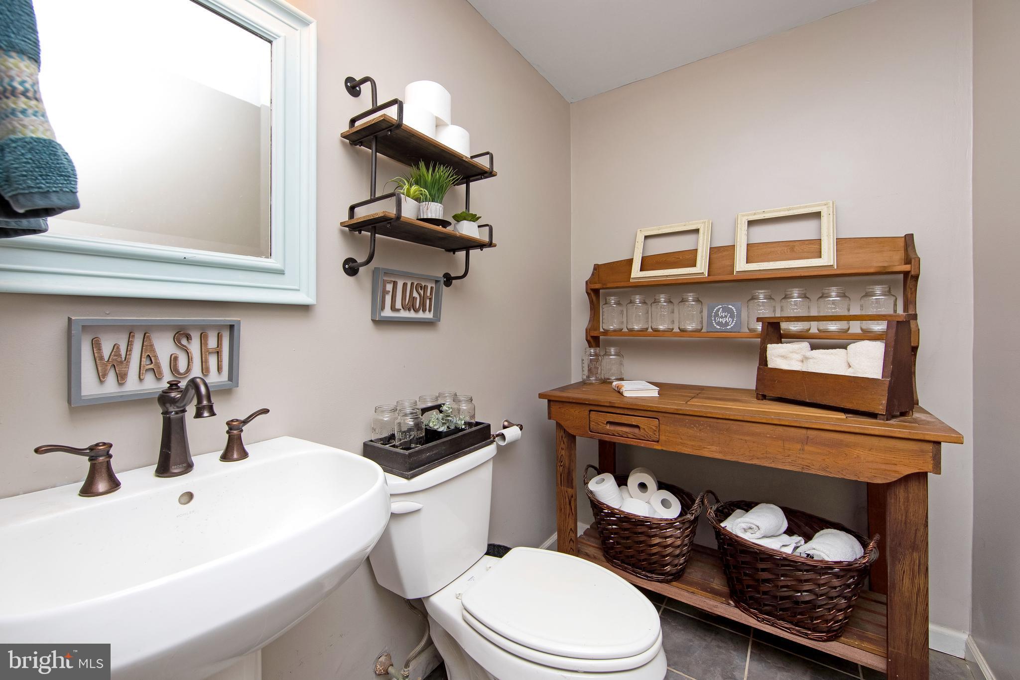 27 Wicklow Drive Tabernacle, NJ 08088 - Photo 23 of 65 a bathroom with a toilet a sink and a mirror