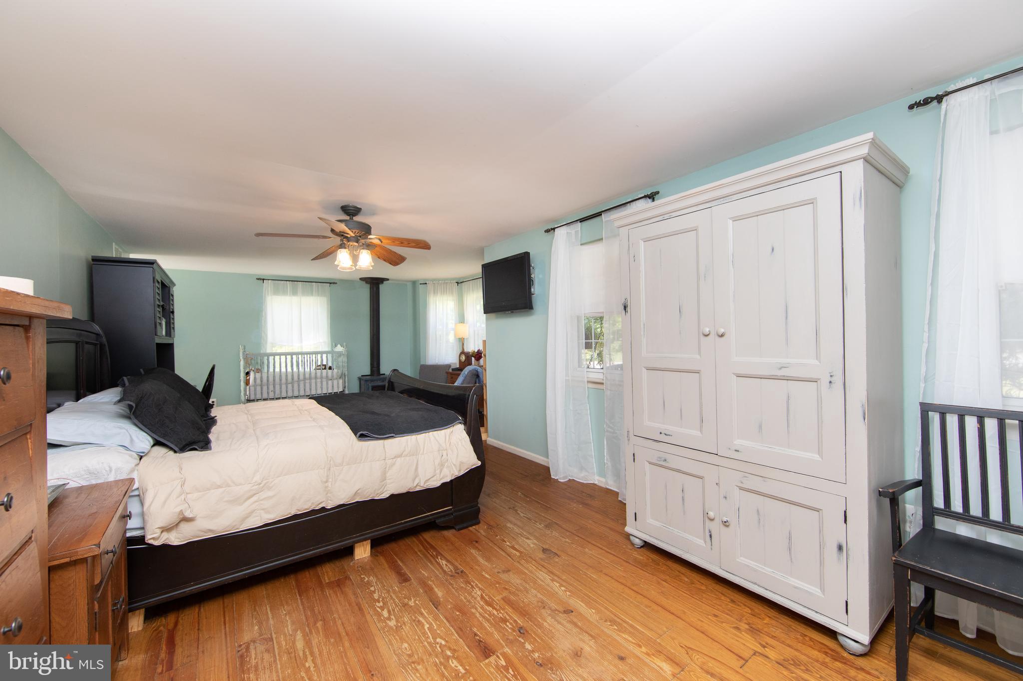 27 Wicklow Drive Tabernacle, NJ 08088 - Photo 24 of 65 a bedroom with a large bed a chandelier and dresser