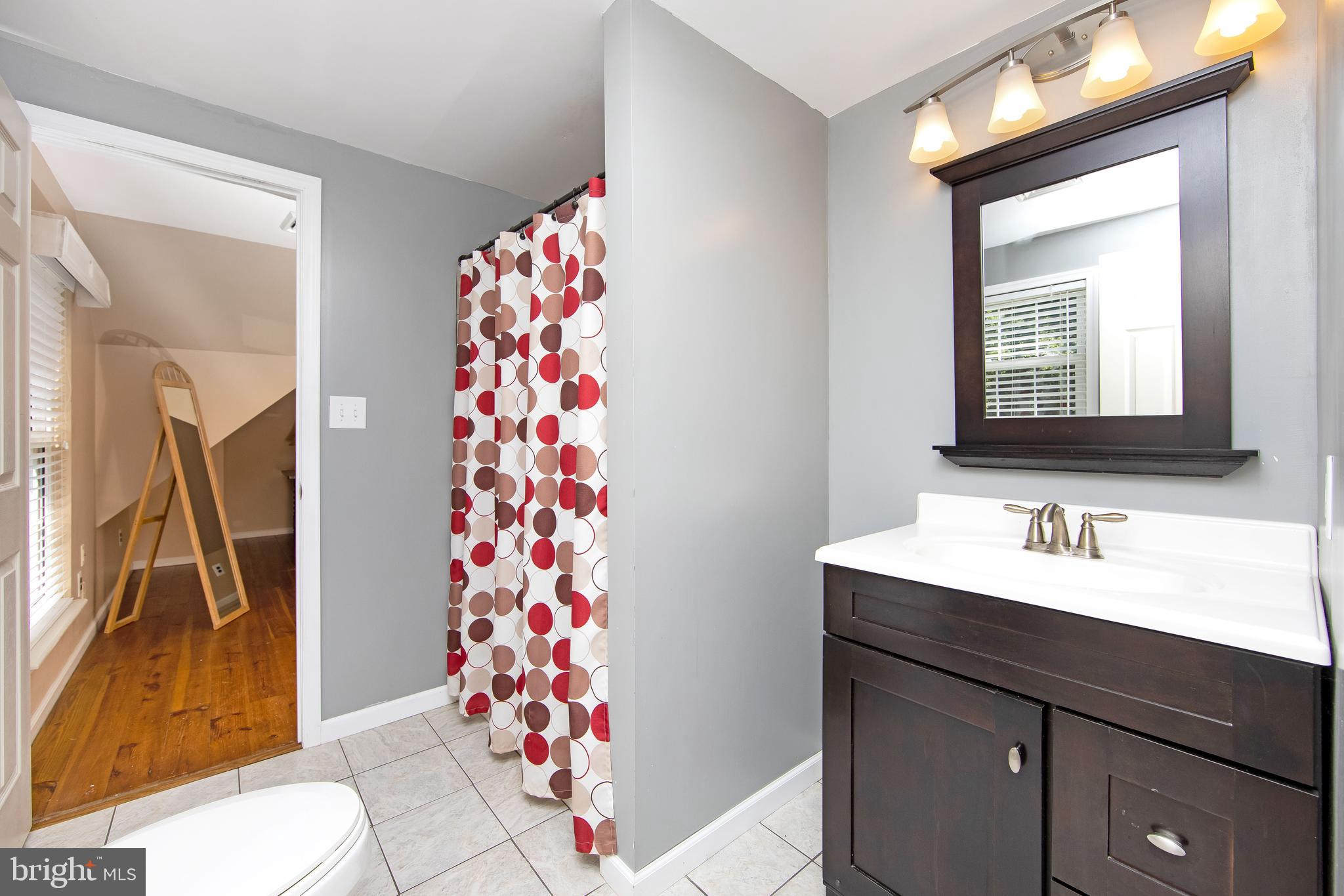 27 Wicklow Drive Tabernacle, NJ 08088 - Photo 34 of 65 a bathroom with a sink mirror and toilet