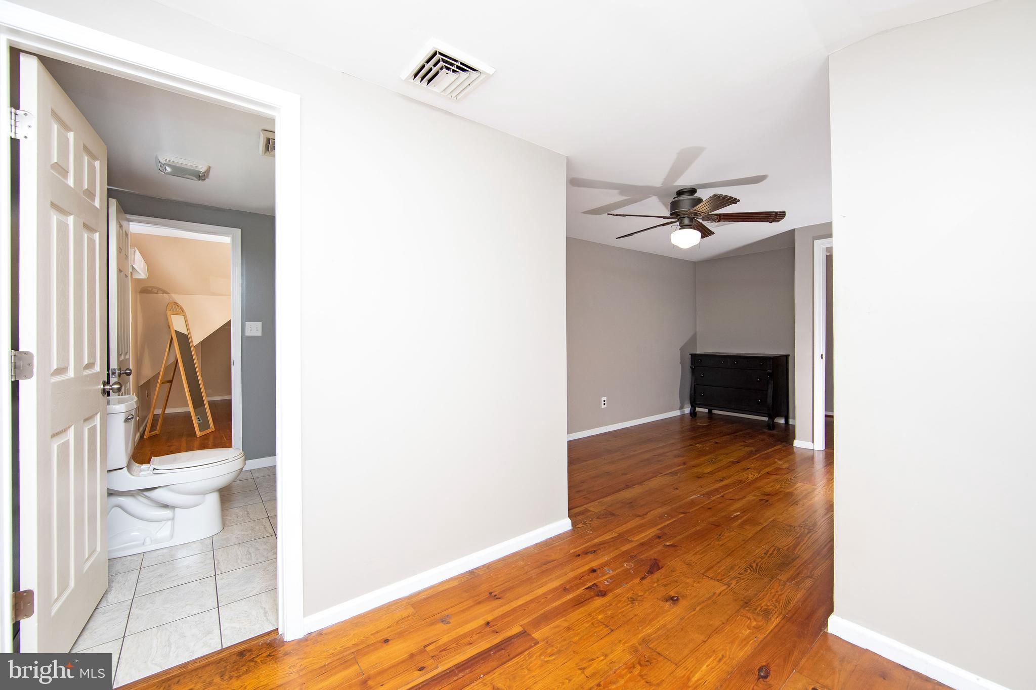 27 Wicklow Drive Tabernacle, NJ 08088 - Photo 36 of 65 a view of an empty room and wooden floor