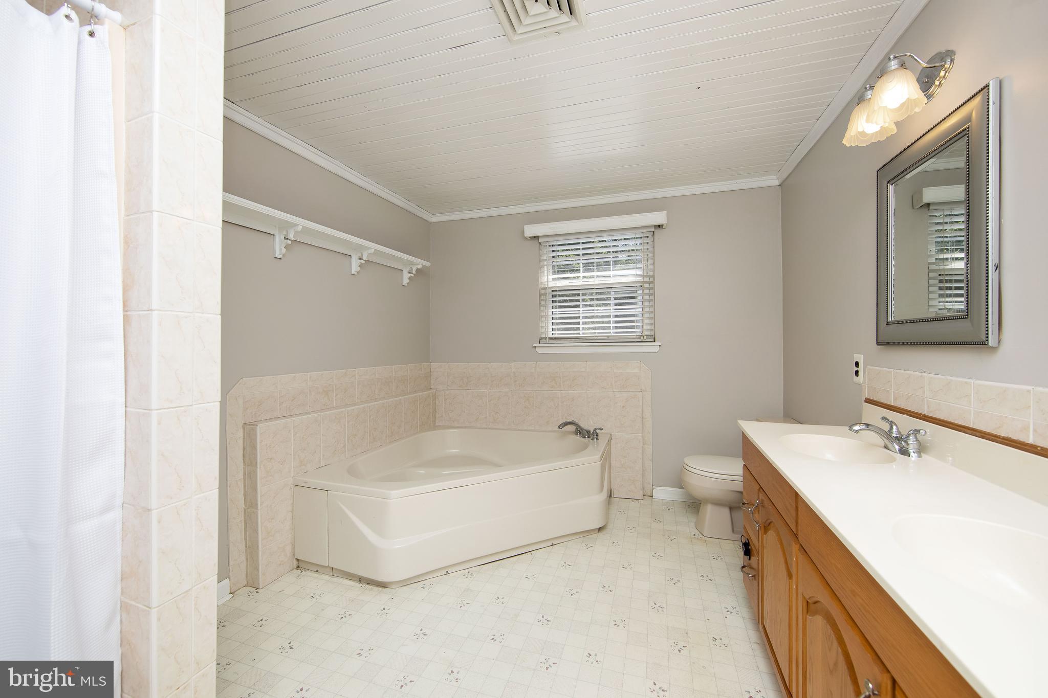 27 Wicklow Drive Tabernacle, NJ 08088 - Photo 38 of 65 a bathroom with a tub sink and mirror