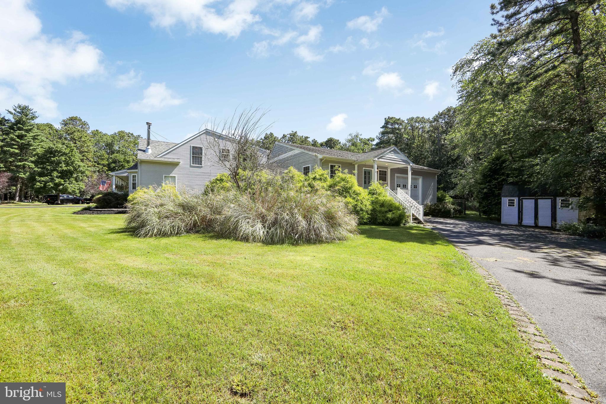 27 Wicklow Drive Tabernacle, NJ 08088 - Photo 40 of 65 a front view of house with yard and trees in the background