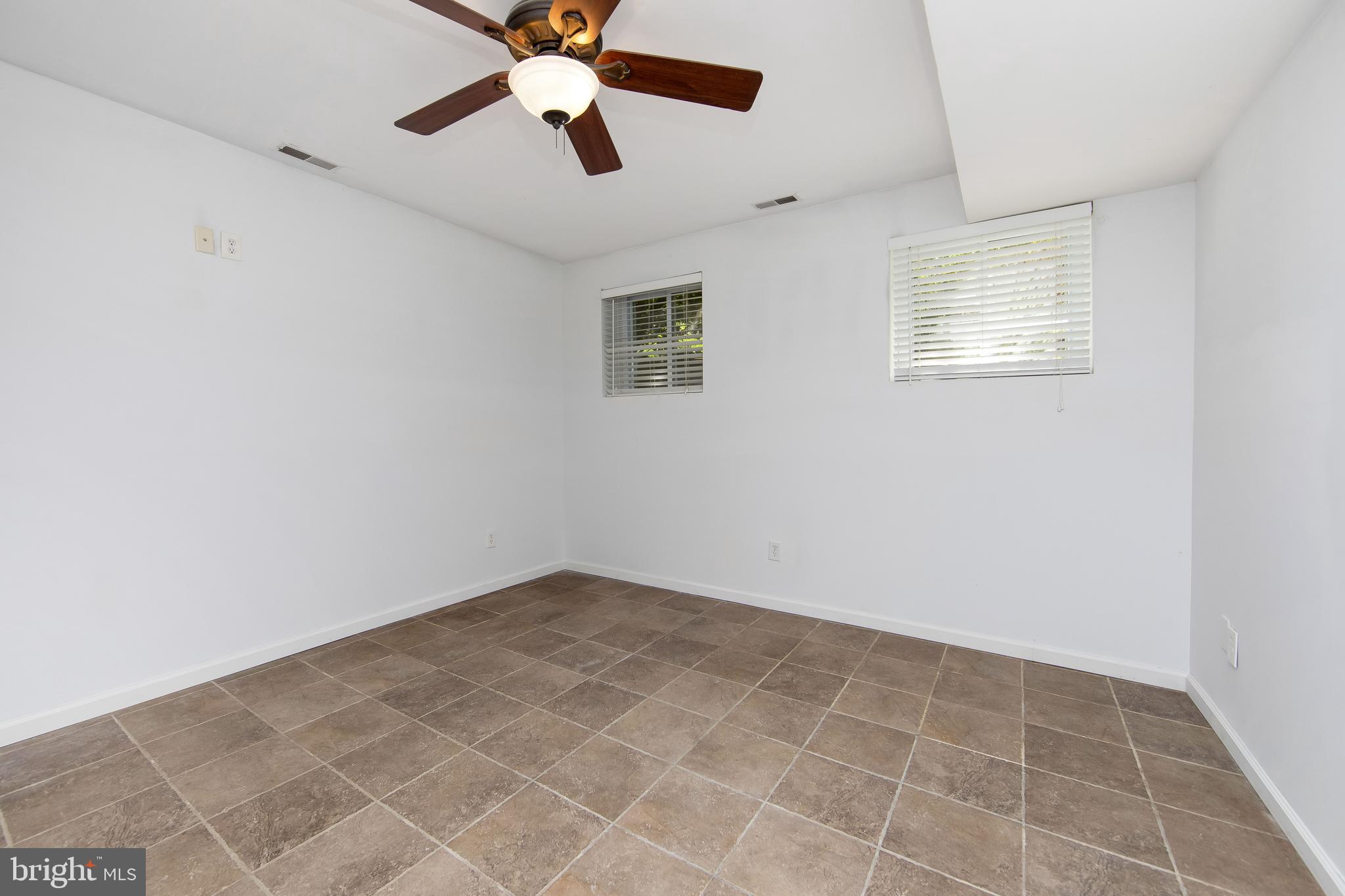 27 Wicklow Drive Tabernacle, NJ 08088 - Photo 63 of 65 an empty room with a window and a fan