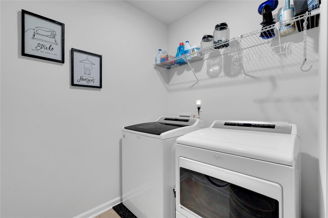 453 Bee Cv Way Pendleton, SC 29670 - Photo 20 of 25 A dedicated laundry space boasts essential appliances and practical overhead shelving.