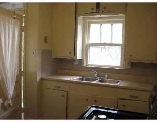 a bathroom with a sink and a window