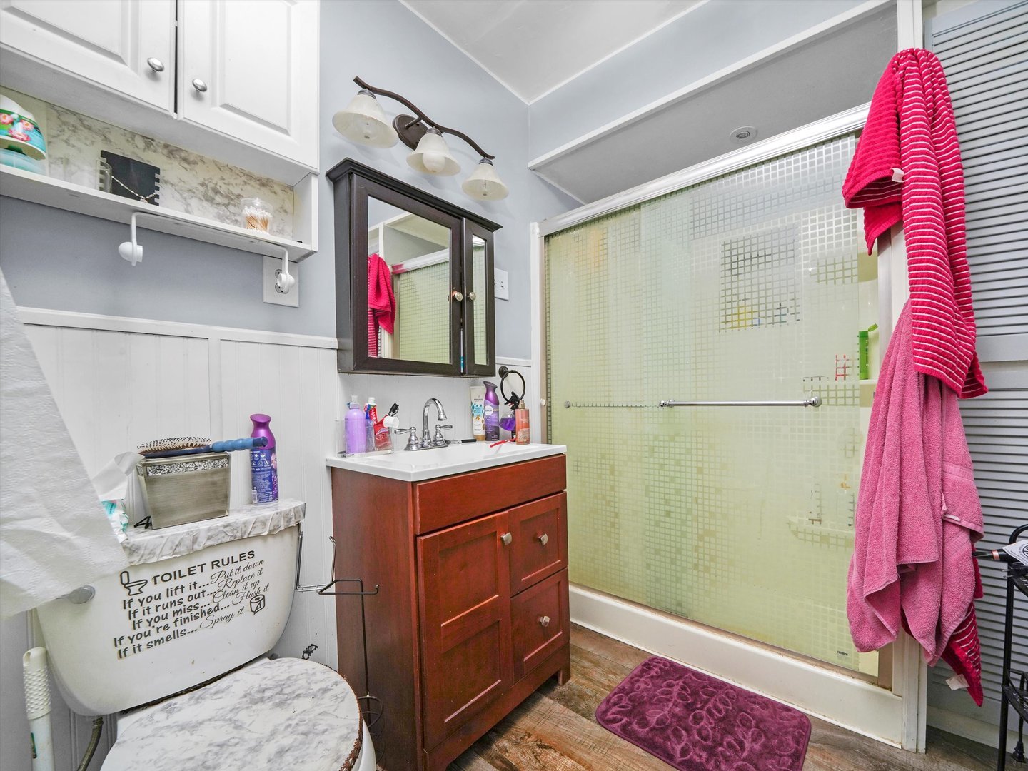2131 North Springfield Avenue Chicago, IL 60647 - Photo 11 of 30 a bathroom with a sink mirror and toilet