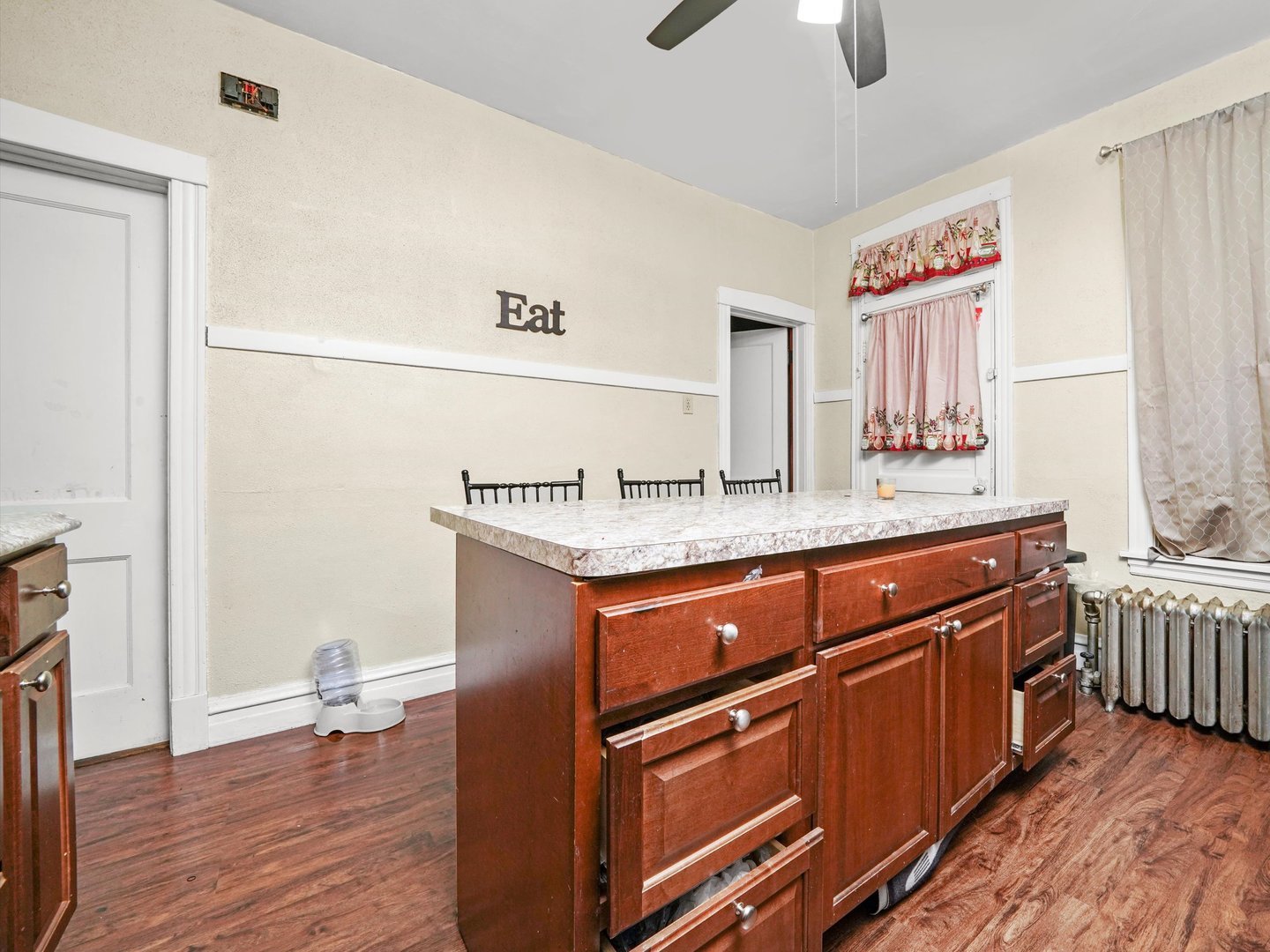 2131 North Springfield Avenue Chicago, IL 60647 - Photo 14 of 30 a kitchen with stainless steel appliances granite countertop a sink and a stove with wooden floor