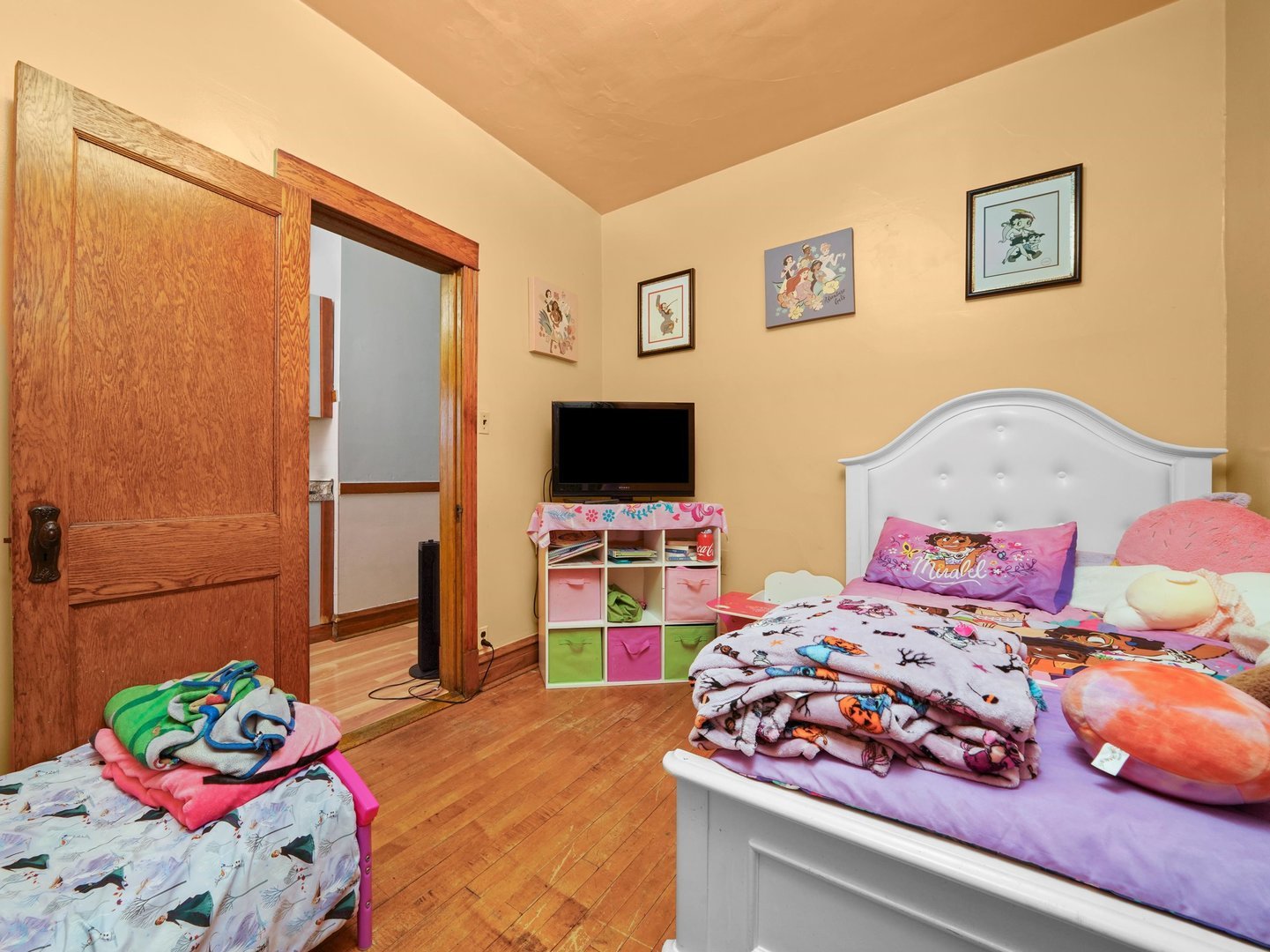 2131 North Springfield Avenue Chicago, IL 60647 - Photo 22 of 30 a bedroom with a bed and a flat screen tv