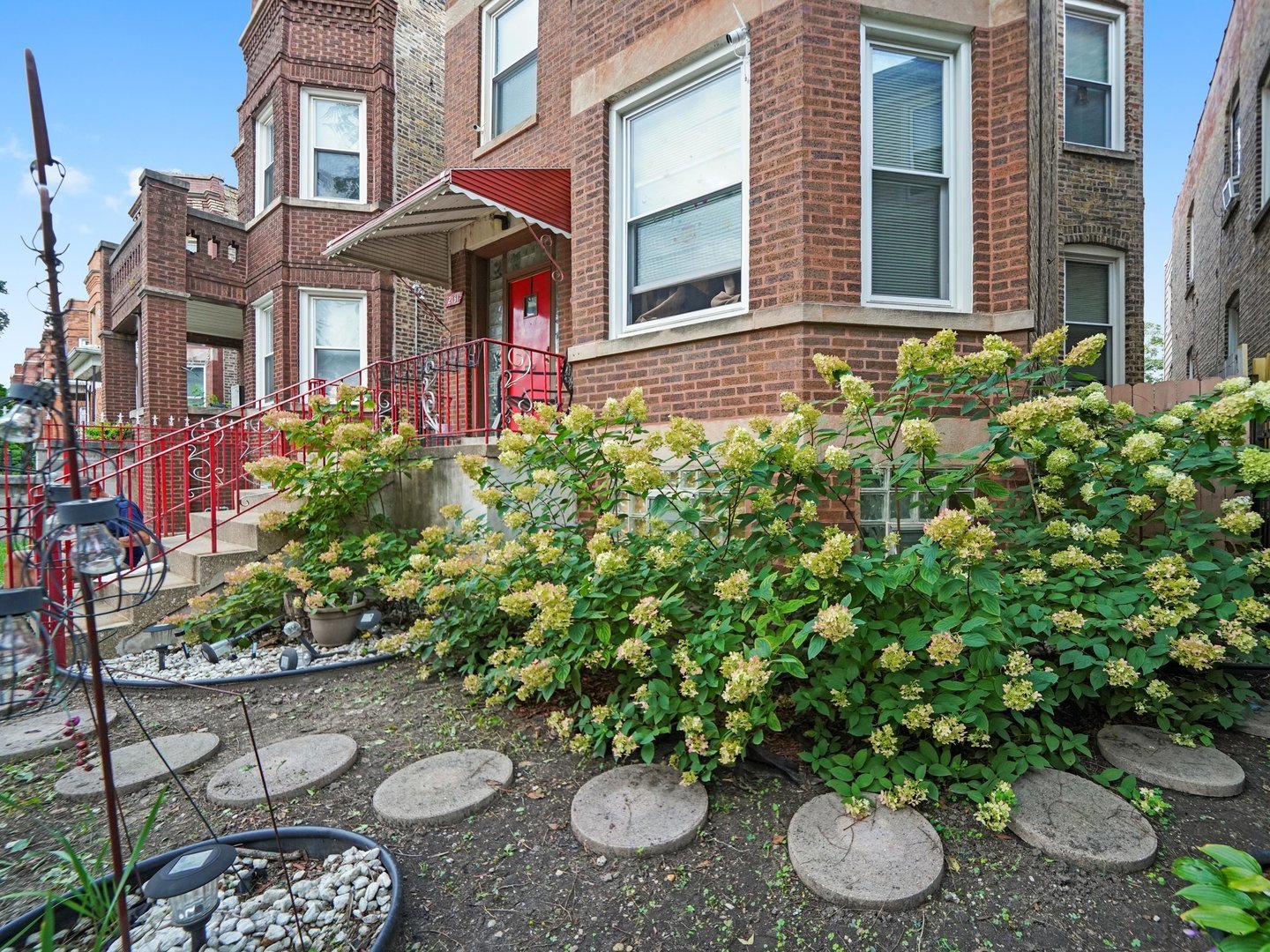 2131 North Springfield Avenue Chicago, IL 60647 - Photo 5 of 30 a view of a backyard with plants and chairs