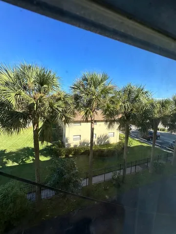 a white toilet sitting next to a bath tub and a shower