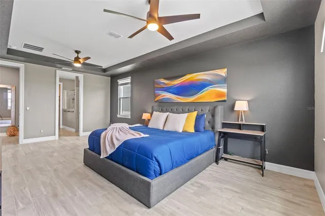 a bedroom with furniture and a window