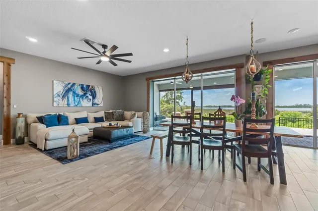 a living room with furniture a table and chairs