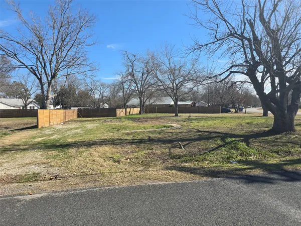 an aerial view of residential houses with city view
