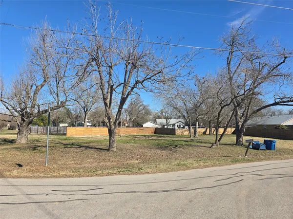 a view of outdoor space with deck and trees