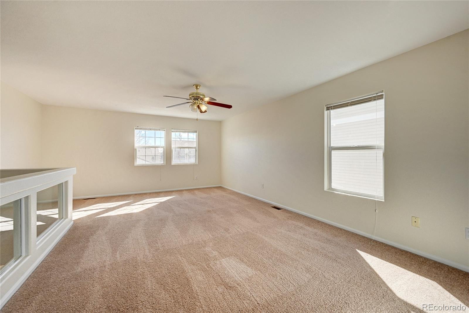 20527 Robins Drive Denver, CO 80249 - Photo 13 of 25 a view of an empty room with a window