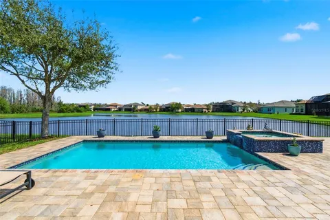 a view of a swimming pool with a yard