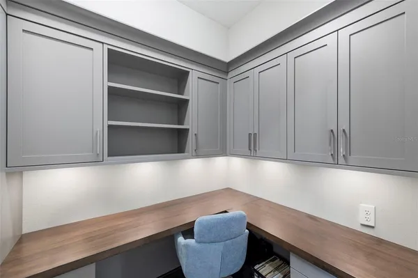 a backyard of a house with outdoor seating