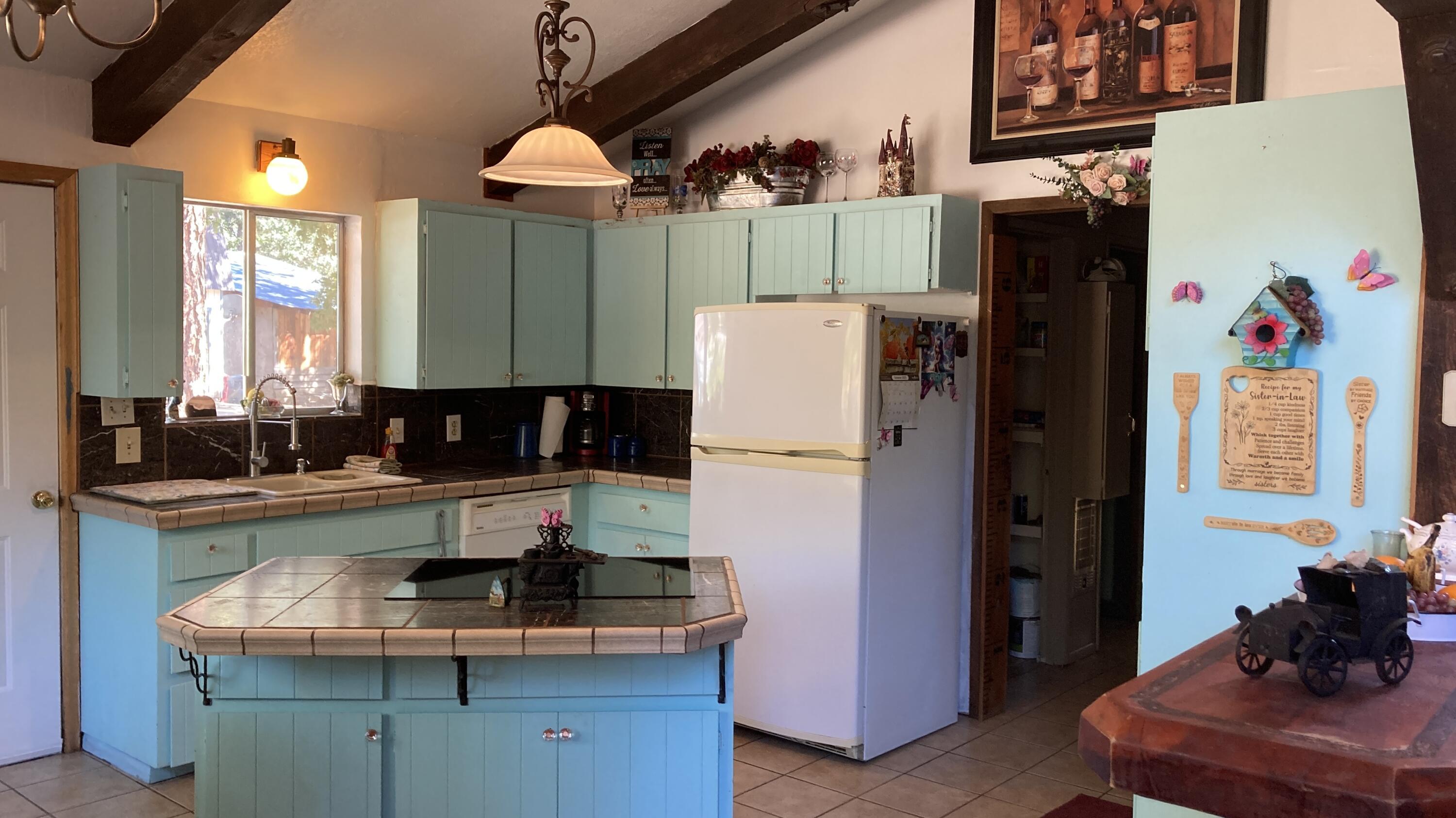 640-540 Iris Road McArthur, CA 96056 - Photo 12 of 41 a kitchen with refrigerator and cabinets