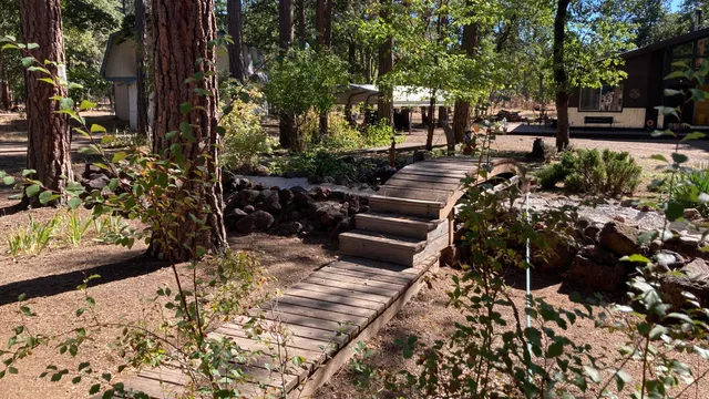 a view of a backyard with sitting area