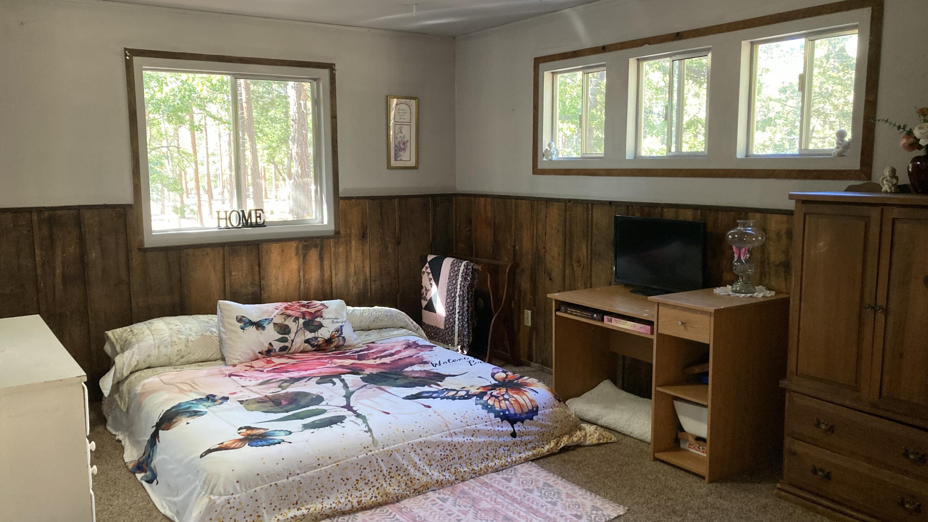 640-540 Iris Road McArthur, CA 96056 - Photo 32 of 41 a bedroom with a bed and a window