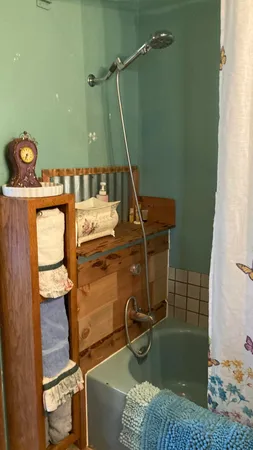 a bathroom with a sink a mirror and a window