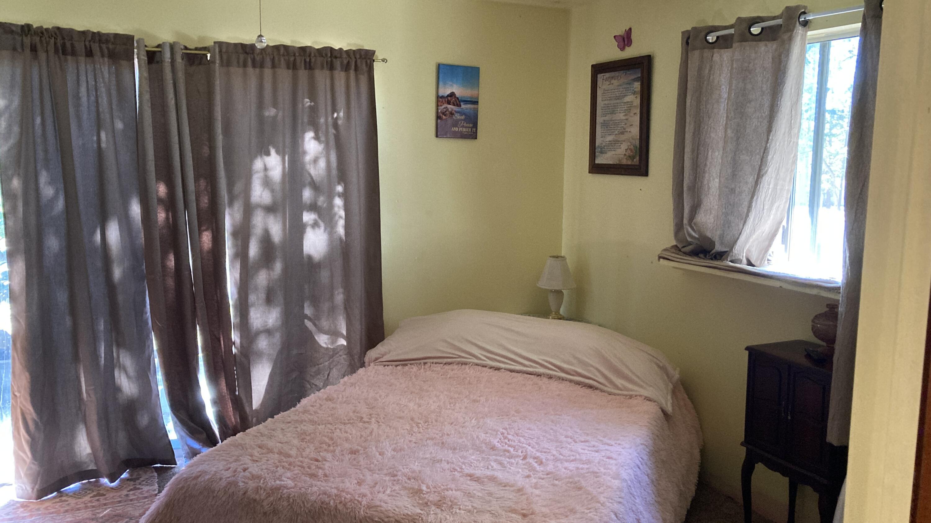 640-540 Iris Road McArthur, CA 96056 - Photo 35 of 41 a bedroom with a bed and a window