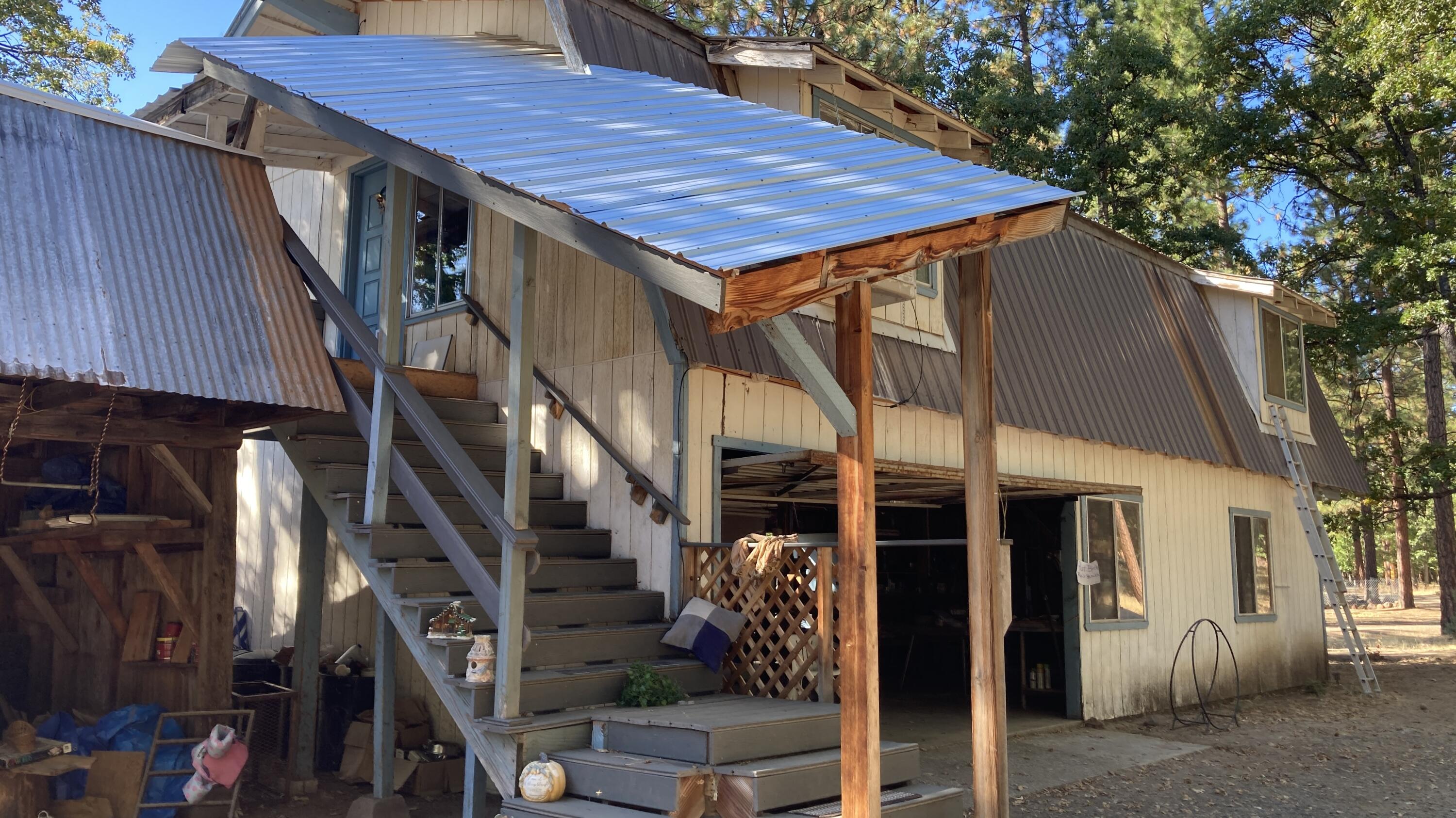 640-540 Iris Road McArthur, CA 96056 - Photo 36 of 41 a view of a house with fountain and potted plants