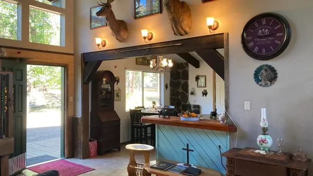 a bathroom with a sink a mirror and a large window