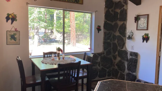 a view of a dining room with furniture window and outside view