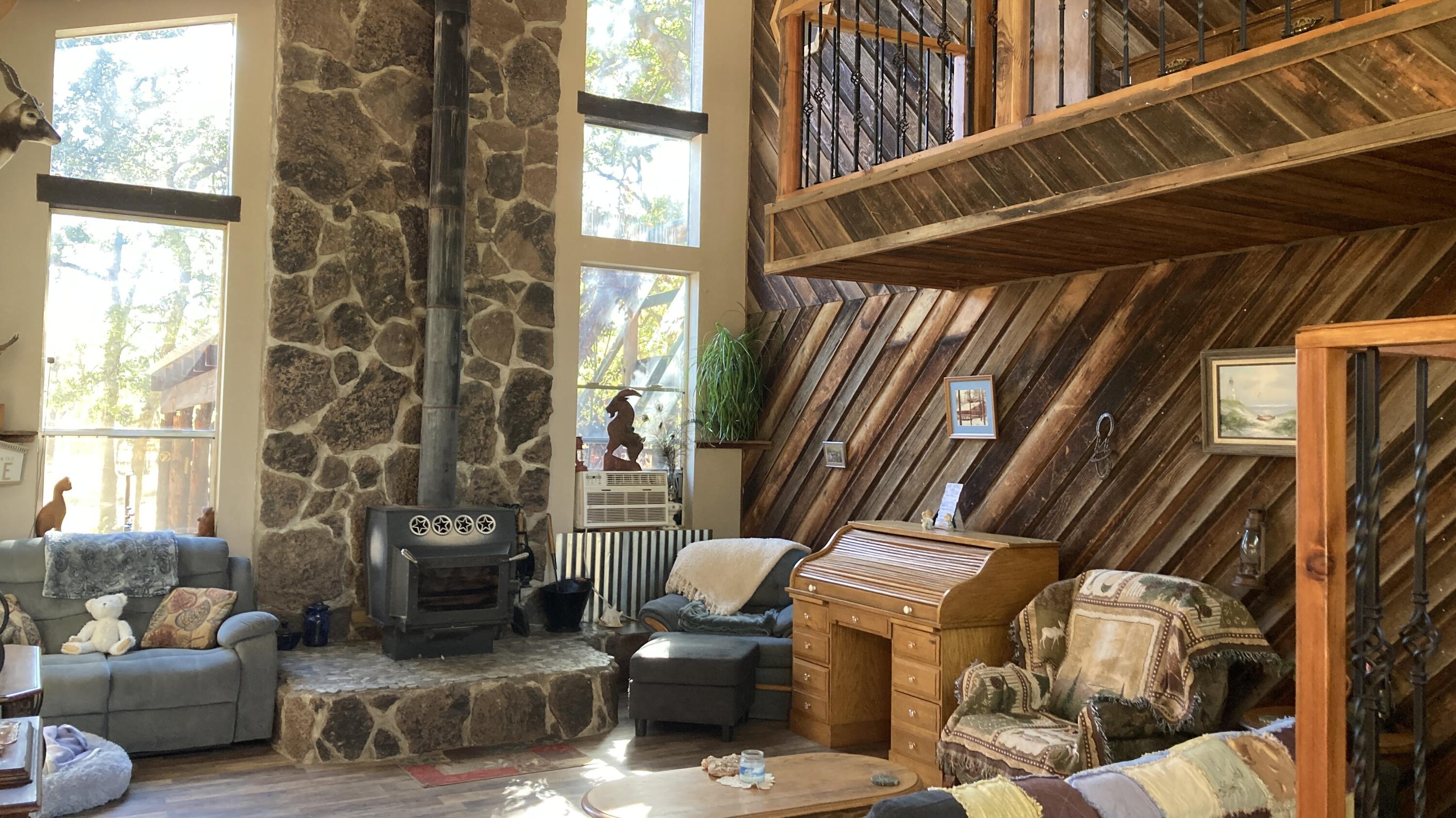 640-540 Iris Road McArthur, CA 96056 - Photo 10 of 41 a living room with furniture and a window
