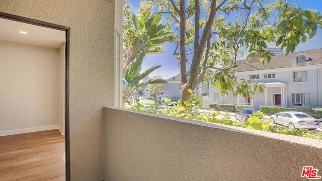 a view of a garden from a balcony