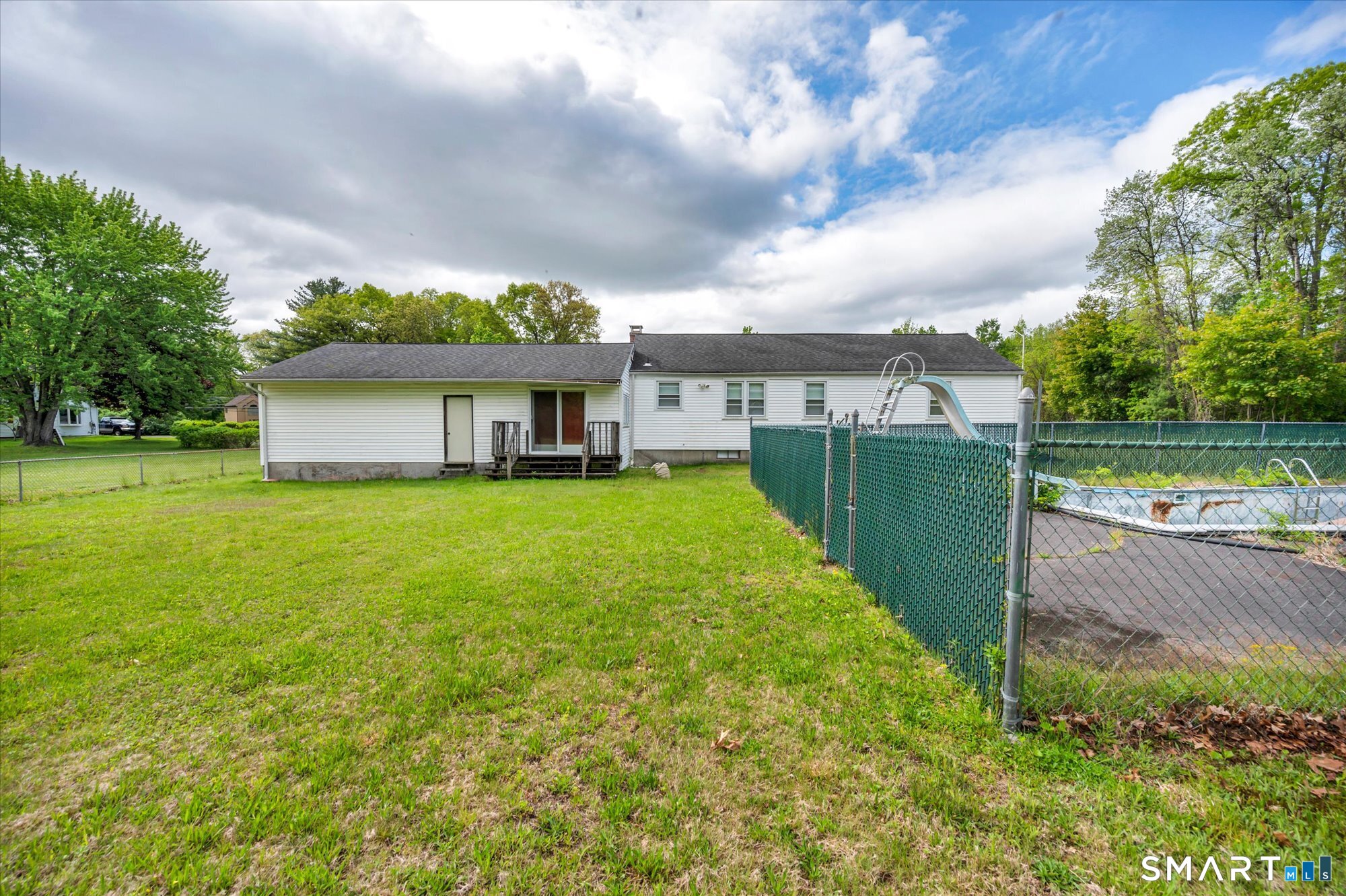 740 Rainbow Road Windsor, CT 06095 - Photo 5 of 40 a view of a house with a garden and yard