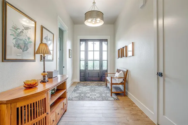a bedroom with bed and wooden floor