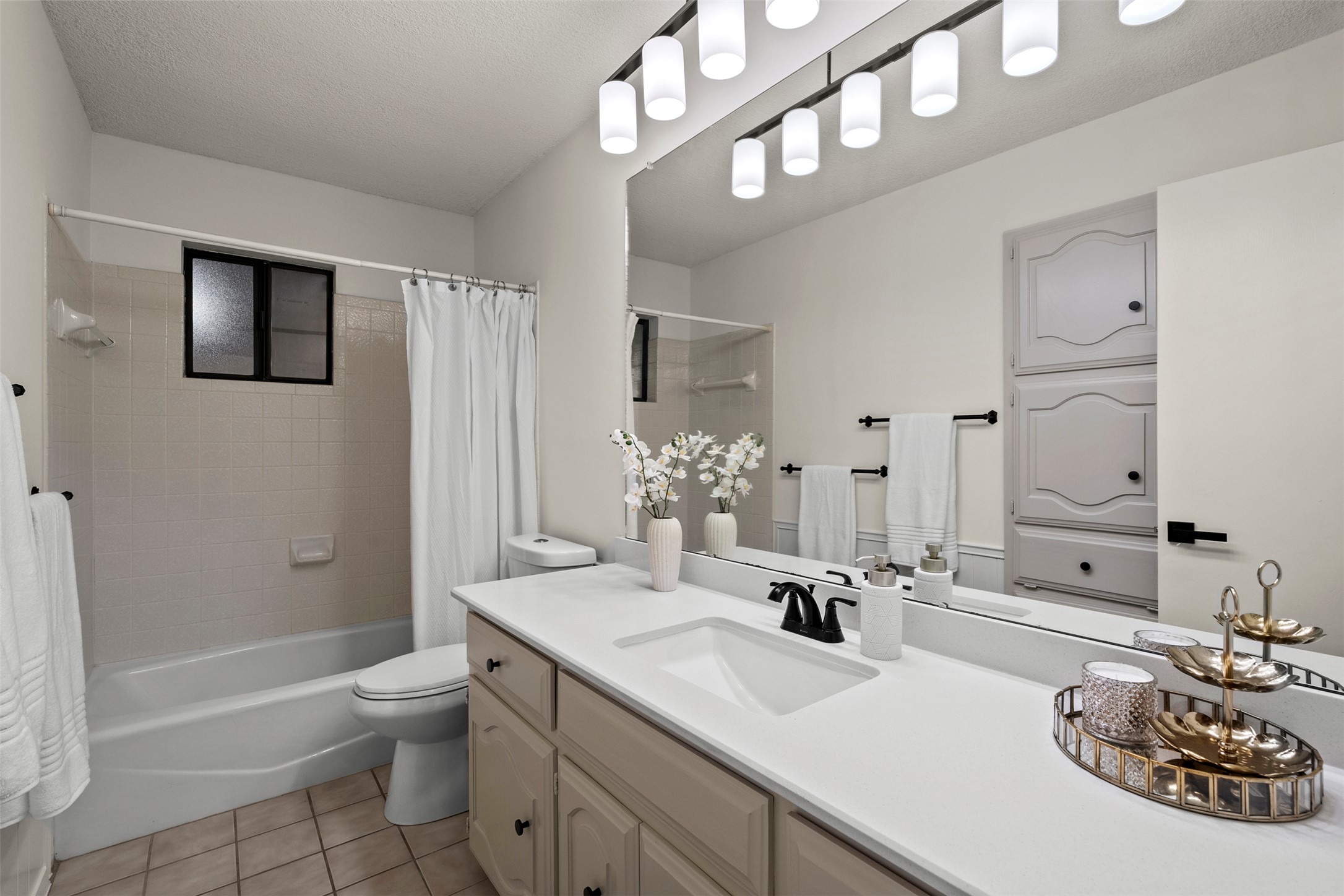 303 West Sequoia Spur Georgetown, TX 78628 - Photo 21 of 34 a bathroom with a sink a toilet and shower